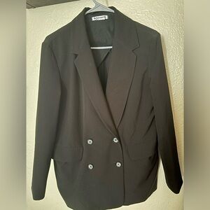 Reformation black blazer in size M